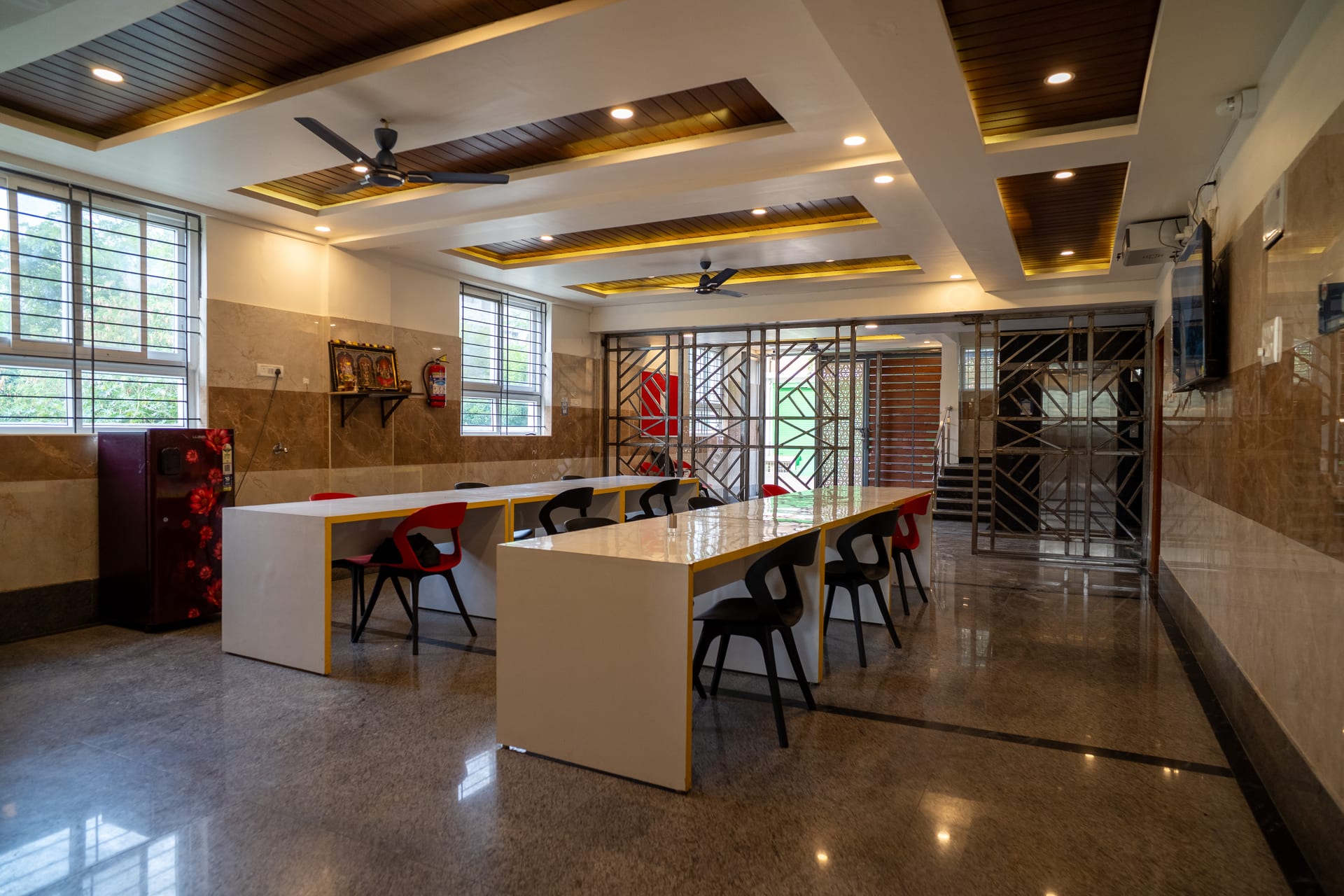 Dining area and common room at Bravado House PG, Bangalore